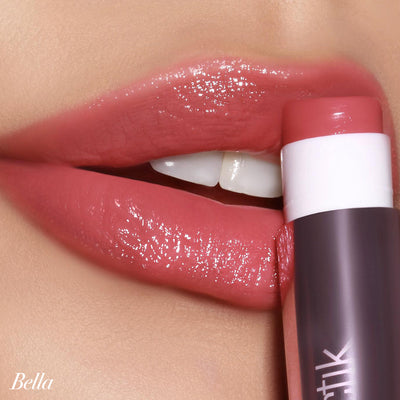 Smoothly applied Girlactik Jello Gloss Balm in Bella, showcasing glossy, nourished lips with pink lemonade scent.