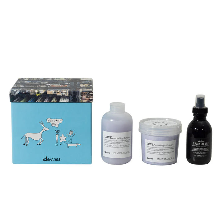 Davines Love Smoothing Oi Gift Set with shampoo, conditioner, and leave-in milk for frizz control and enhanced smoothness.