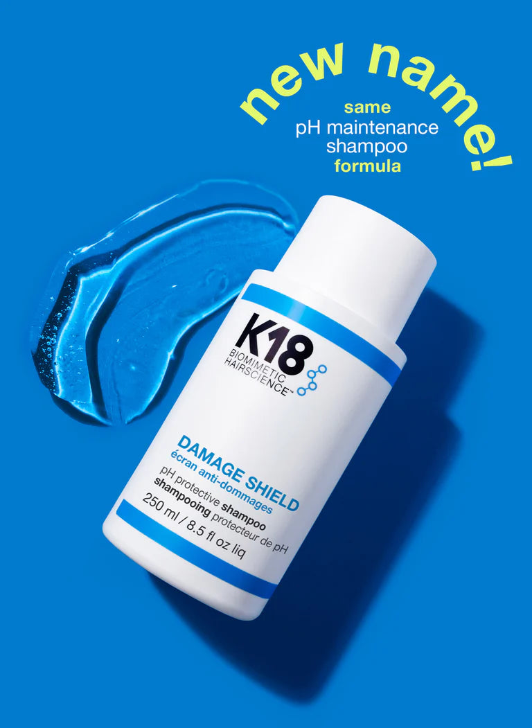 K18 DAMAGE SHIELD pH protective shampoo bottle with blue gel, highlighting new name and same formula.