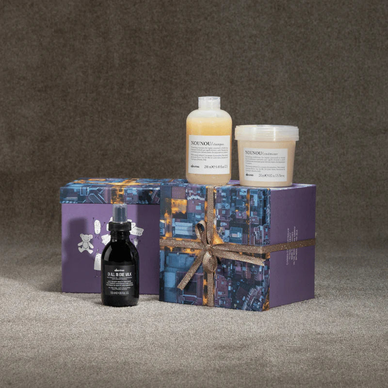 Davines Nounou Gift Set featuring Nounou Shampoo, Conditioner, and OI All-in-One Milk in elegant packaging.