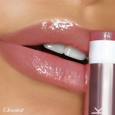 Girlactik Jello Gloss Balm applied on lips, showcasing a glossy finish and pink lemonade scent in a dreamy, non-sticky formula.