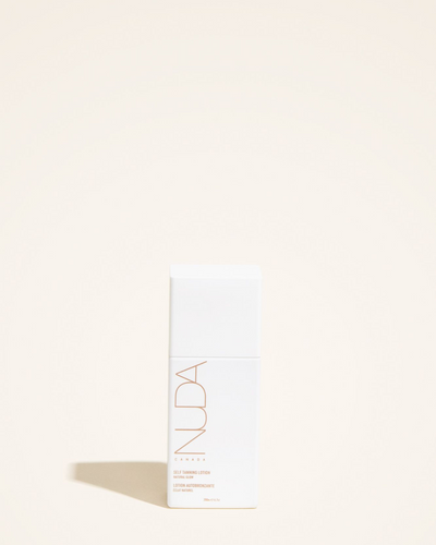 Hydrating self-tanning lotion by Nuda, designed for a natural bronzed glow and enriched with anti-aging ingredients.