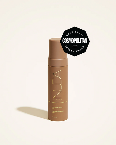 Self tanning mousse in dark shade with Cosmopolitan Beauty Award badge, promoting a radiant and smooth complexion.