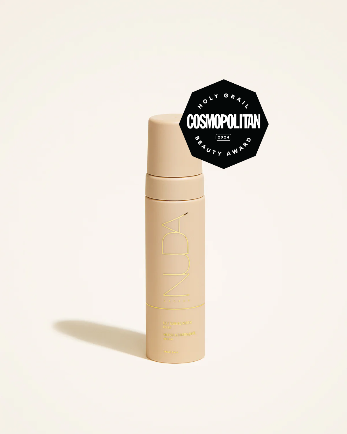 Self tanning mousse in a sleek bottle, awarded Cosmopolitan's Holy Grail Beauty Award, perfect for a natural glow.