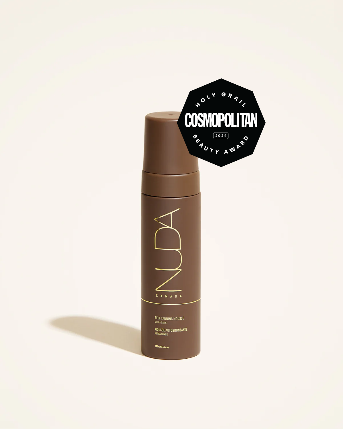 Self Tanning Mousse Ultra Dark in a sleek bottle with Cosmopolitan Beauty Award badge, promoting a radiant complexion.