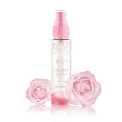 Rose Petal Dewy Face Mist bottle next to pink roses, designed for hydration and a dewy finish.