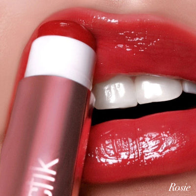 Close-up of lips applying Girlactik Jello Gloss Balm in a vibrant red shade, showcasing a glossy finish and hydration.