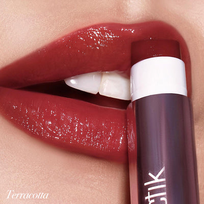 Smooth application of Girlactik Jello Gloss Balm in Terracotta on luscious, shiny lips. Hydrating and glossy finish.