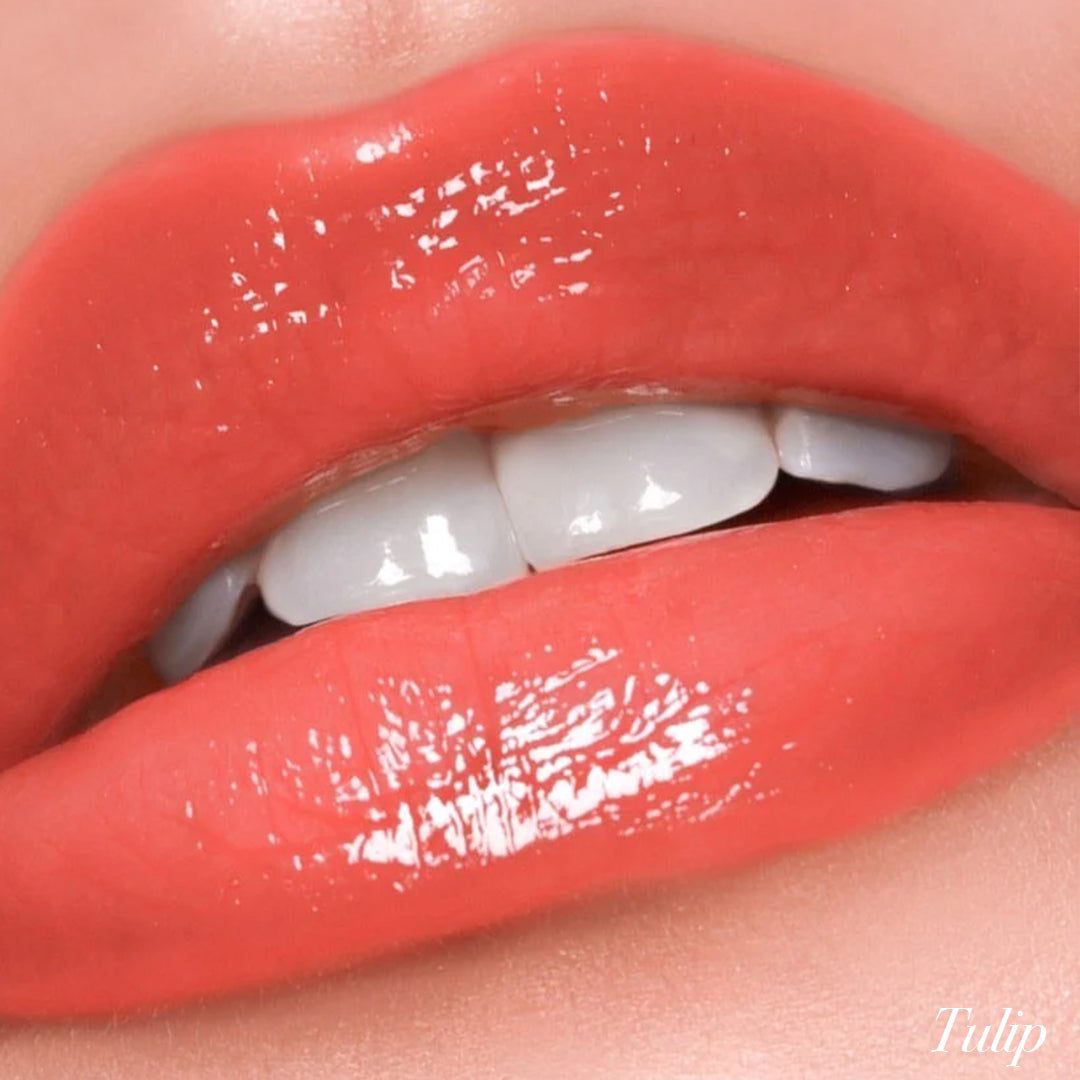 Smooth and glossy lips showcasing the Tulip shade of Girlactik Jello Gloss Balm with a shiny finish.