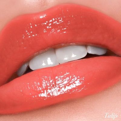 Smooth and glossy lips showcasing the Tulip shade of Girlactik Jello Gloss Balm with a shiny finish.