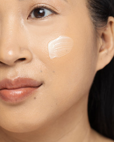 Close-up of a person applying DERMA-V™ cream to improve skin barrier and hydration.