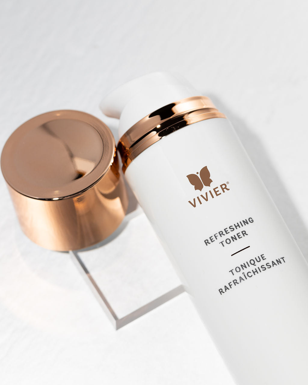 Vivier Refreshing Toner bottle with a gold cap, showcasing a gentle, alcohol-free skincare toner.