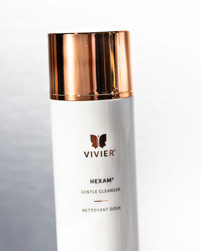 Vivier HEXAM gentle gel cleanser in a sleek bottle with a gold and white design for all skin types.