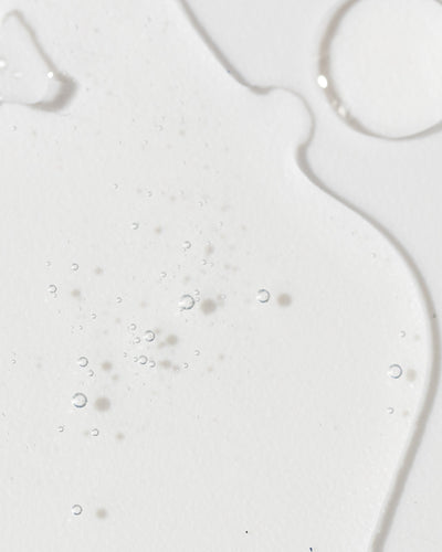 Close-up of Vivier Radiance Serum, showcasing its smooth texture and fine bubbles on a white background.