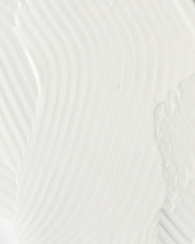 close-up of smooth, creamy texture of a soothing skincare product for calming redness and irritation