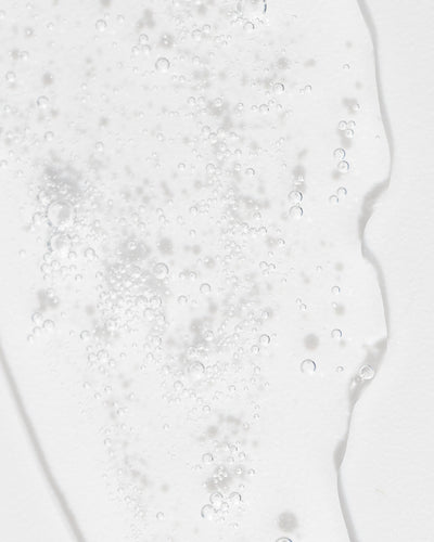 Close-up of refreshing toner texture with bubbles, showcasing its gentle, hydrating properties for skin care.