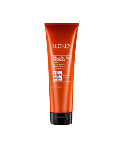 Redken Frizz Dismiss Rebel Tame Cream in an orange tube, designed for smoothing and controlling frizz in all hair types.