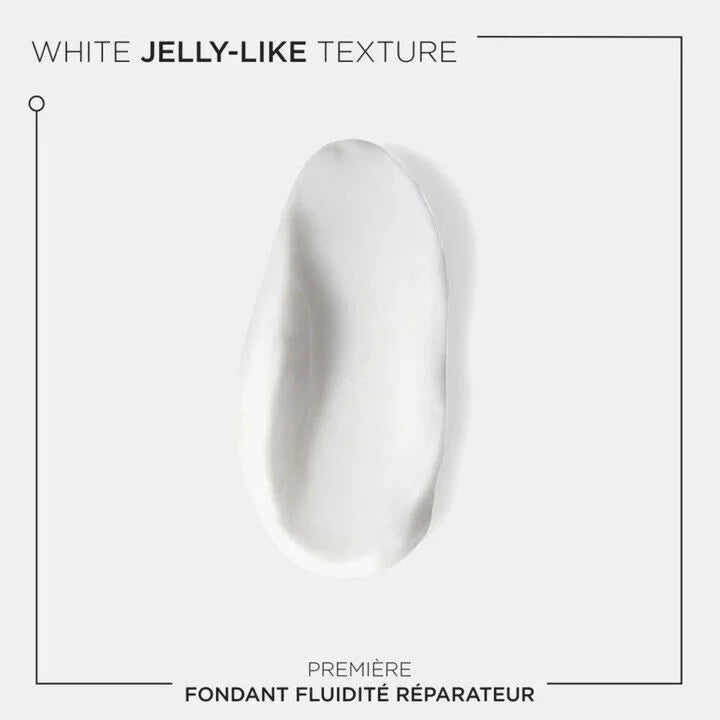 White jelly-like texture of Première Fondant Fluidité Réparateur treatment for damaged hair.