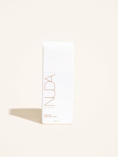 Nuda body cream bottle on a neutral background, designed for deep skin hydration and nourishment.