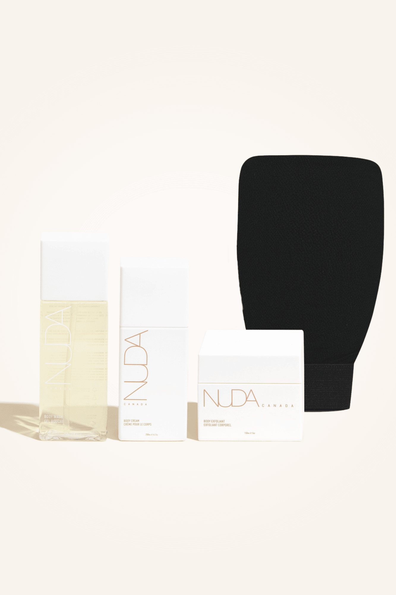 Body Essentials Kit featuring exfoliant, tan remover, moisturizer, and exfoliating mitt for perfect sunless tanning.