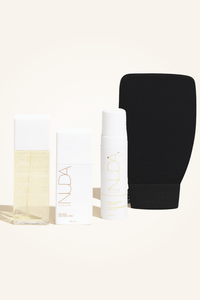 Body Essentials Kit featuring exfoliant, tan remover, cream, and exfoliating mitt for sunless tanning.