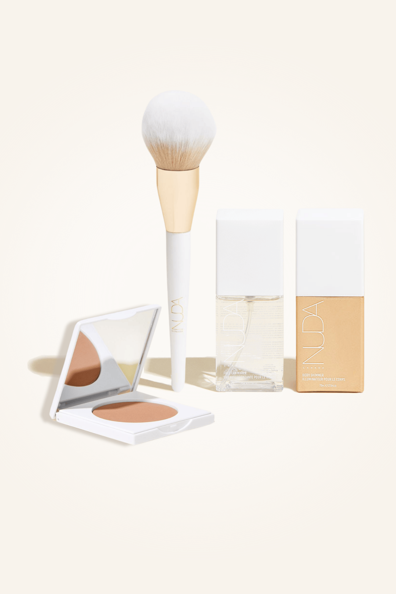 Deluxe Bronzed Kit featuring a bronzing powder, brush, body shimmer, and facial self tanner for a flawless glow.