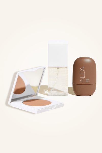 Deluxe Bronzed Trio featuring facial self tanner, bronzing powder, and bronzing glow drops for a radiant complexion.