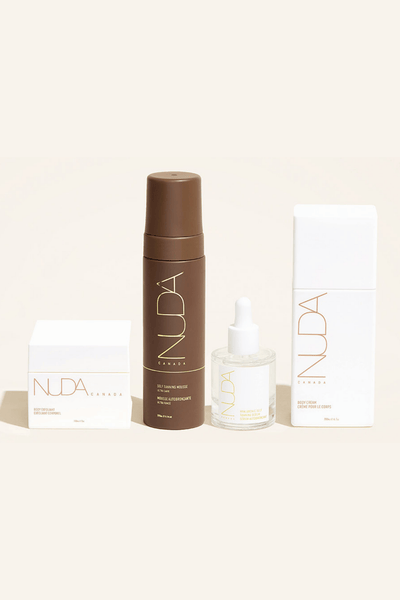 Nuda Routine Kit featuring body exfoliant, self tanning mousse, face tanner, and body cream for a customizable tan.