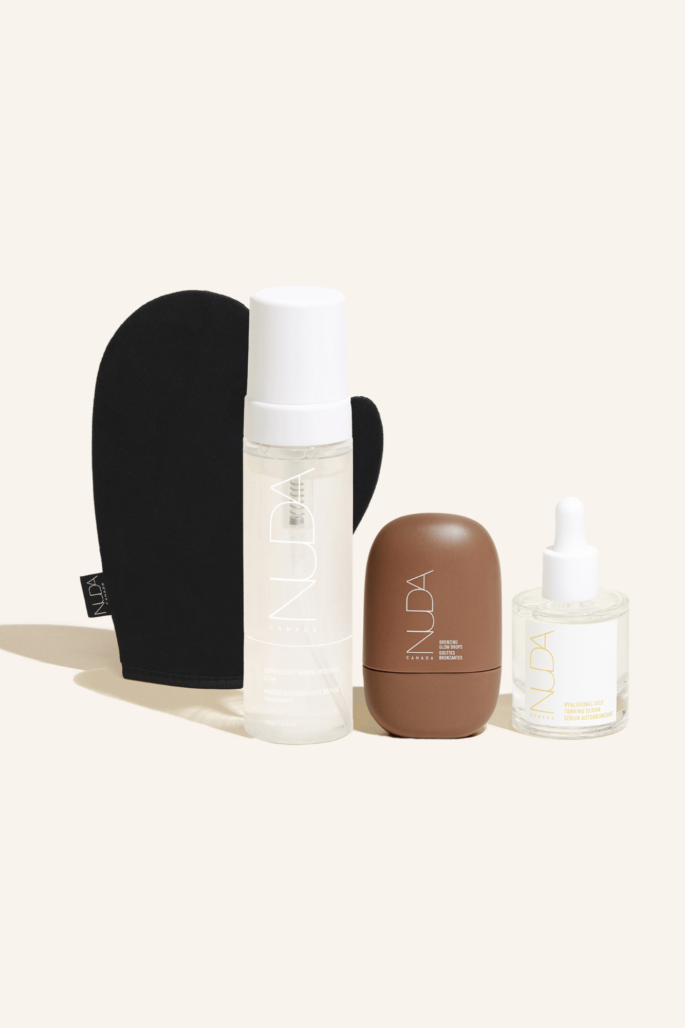 Ultimate Glow Kit featuring self tanning mousse, facial tanner, and tanning mitt for a flawless glow.