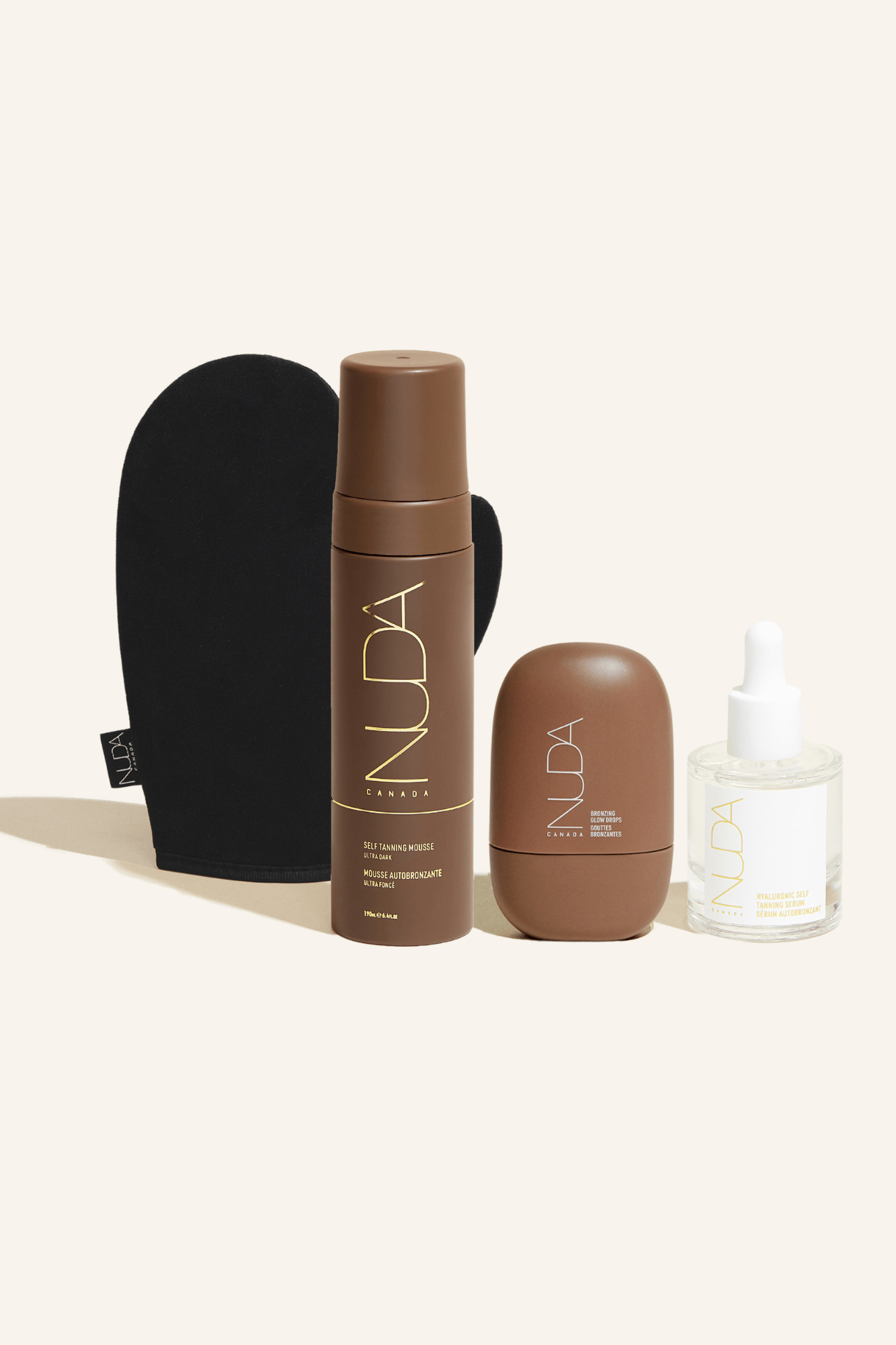 Ultimate Glow Kit with self tanning mousse, tanning mitt, and bronzing glow drops for a radiant complexion.