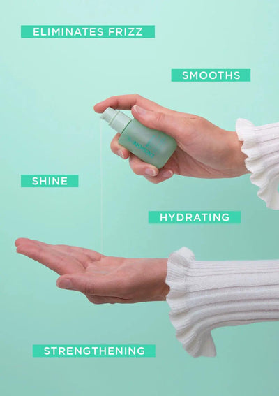 Hand holding a small bottle of styling product, showcasing benefits like frizz elimination and hydration.