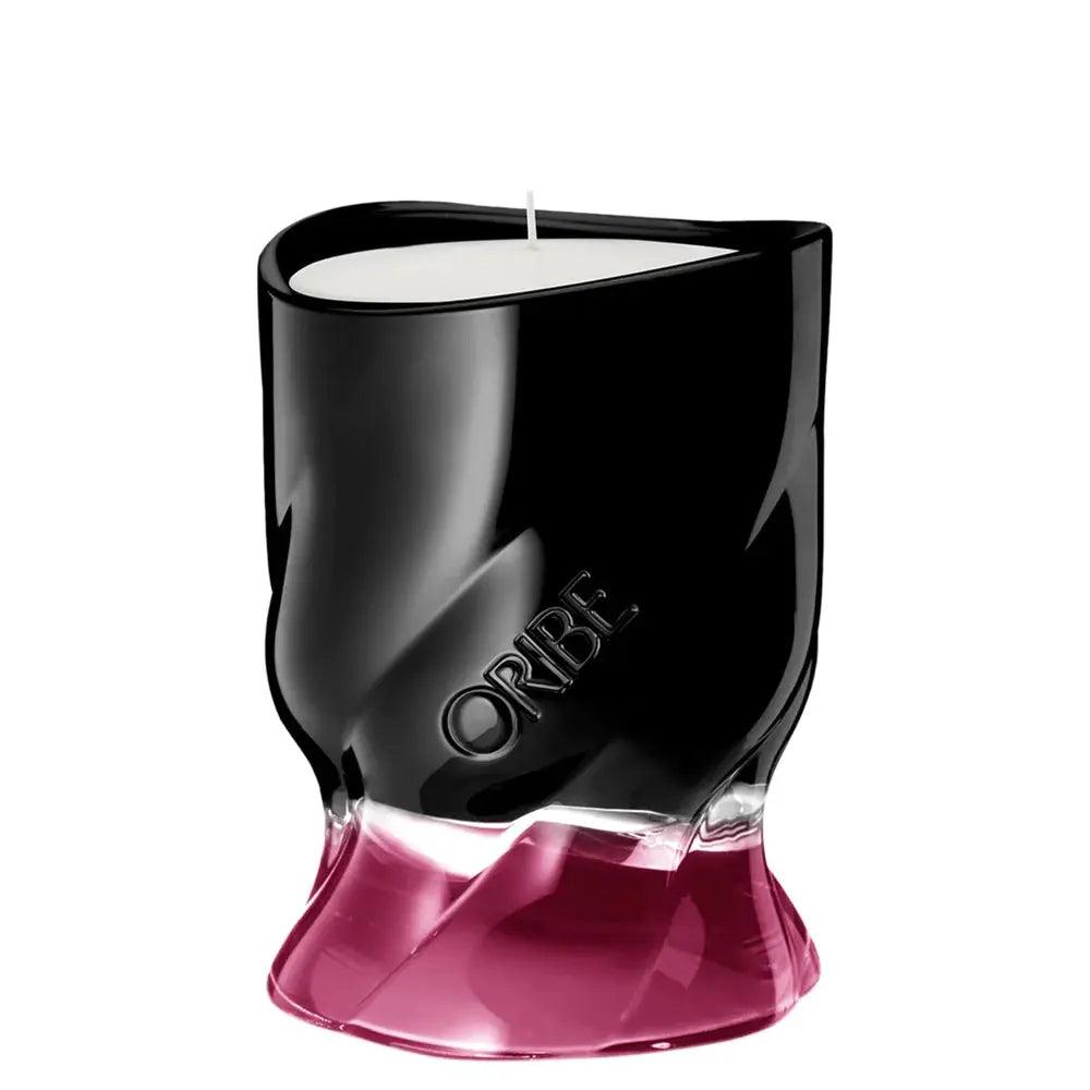 ORIBE Valley of Flowers scented candle in elegant black and pink design, enhancing any ambiance.