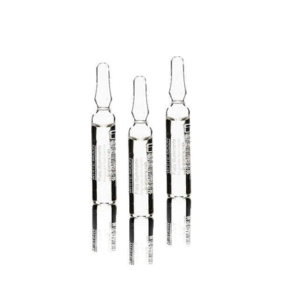 three clear glass vials of White Moon Brightening serum reflecting light, ideal for brightening dull skin