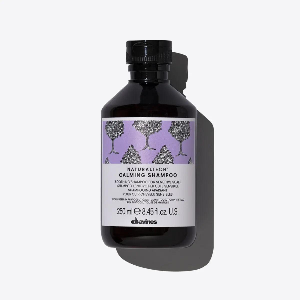 Davines Naturaltech Calming Shampoo 250ml for sensitive scalp with soothing formula in black bottle and purple label.