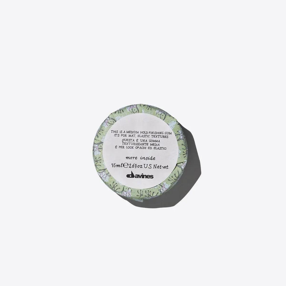 Davines hair finishing gum 75ml for elastic and irregular looks in round green-labeled container on white background.