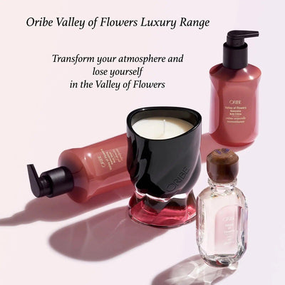 Oribe Valley of Flowers luxury range products, including a scented candle and hair care bottles, for a fragrant atmosphere.