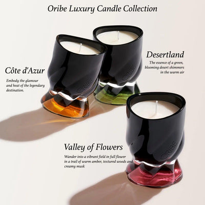 Oribe Luxury Candle Collection featuring Valley of Flowers, Côte d'Azur, and Desertland in elegant candle holders.